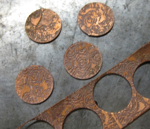 Sue etched a piece of copper, circles were cut out and Sue domed them then soldered on stud backs to make these.....